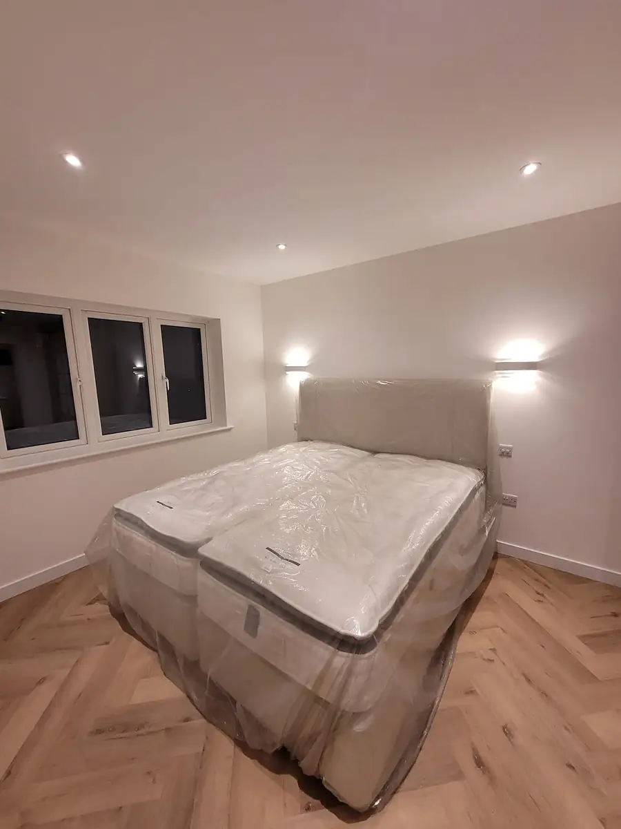 Bedroom with herringbone floor