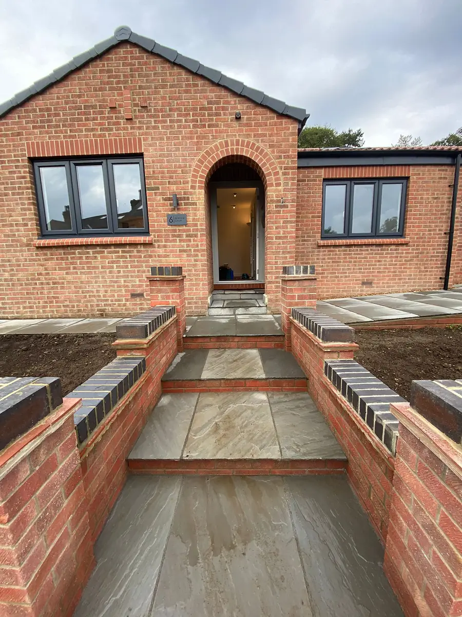 New brick steps and walls to the front door